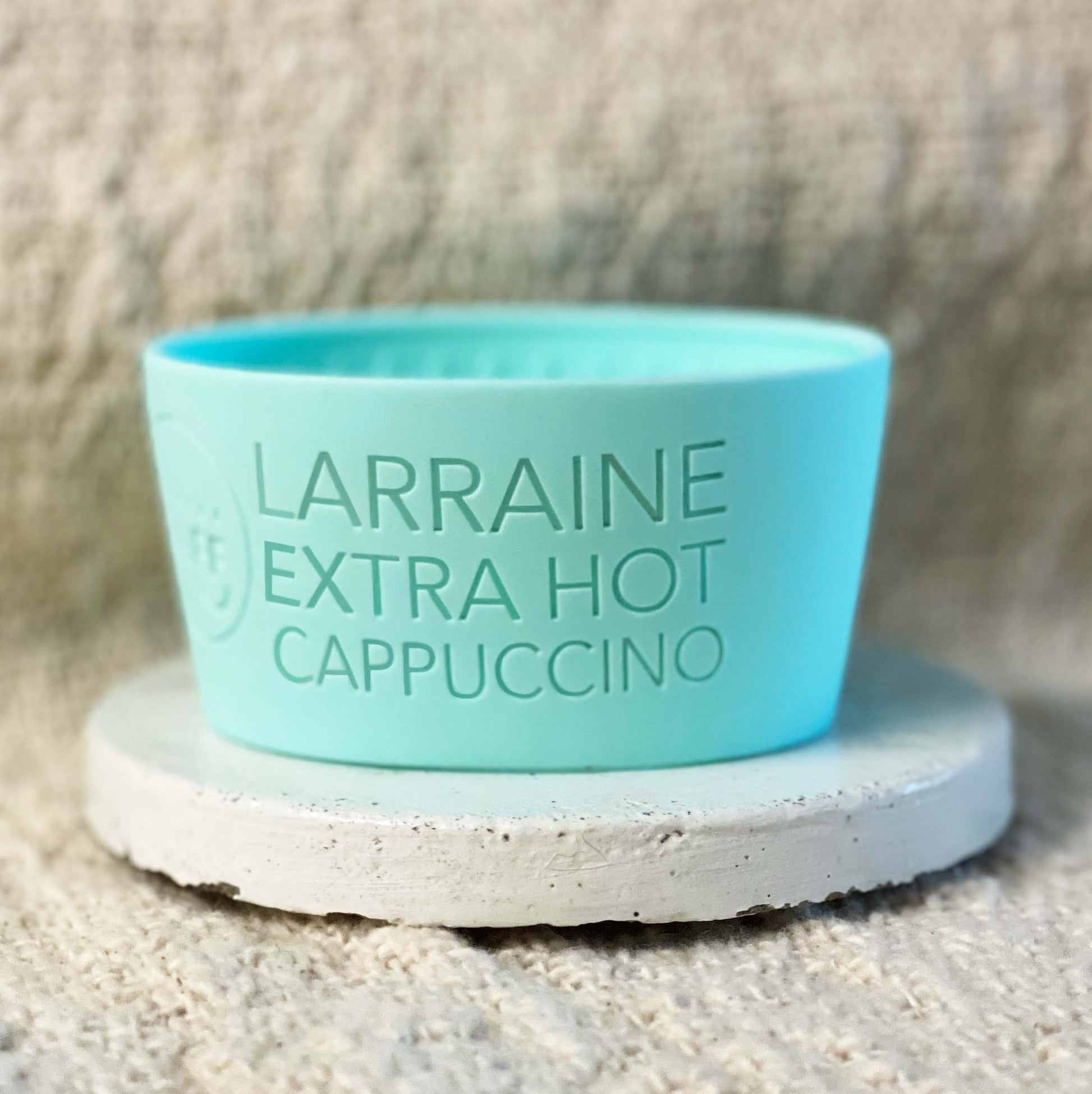 mint green coffee sleeve with capuccino coffee order