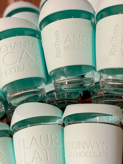 Branded keep cups with rio tinto logo and coffee order