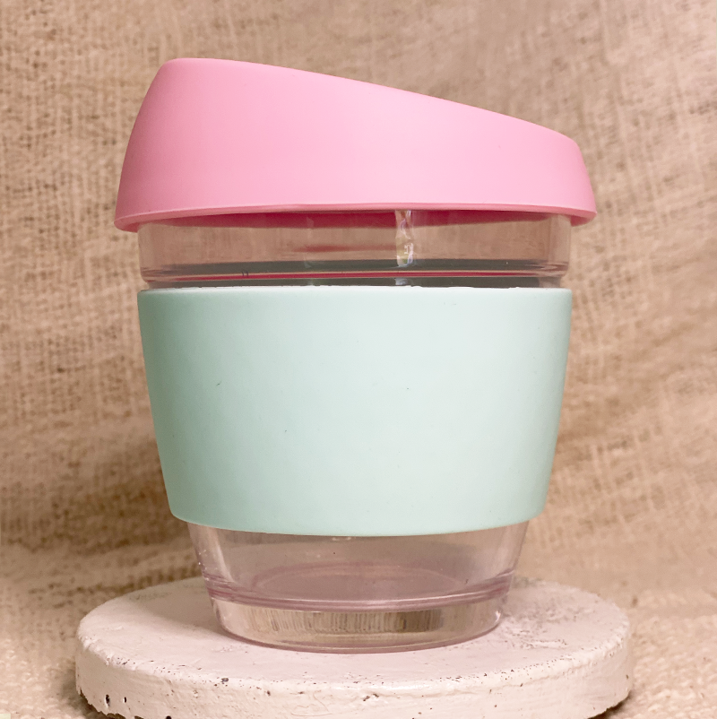 Pink and mint reusable glass coffee cup with personalised custom sleeve