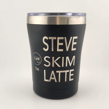 A black insulated tumbler with a clear lid and a stainless steel rim, featuring the text 'STEVE SKIM LATTE' in cream lettering. A small circular logo on the left reads 'Cliff' and '16oz'.