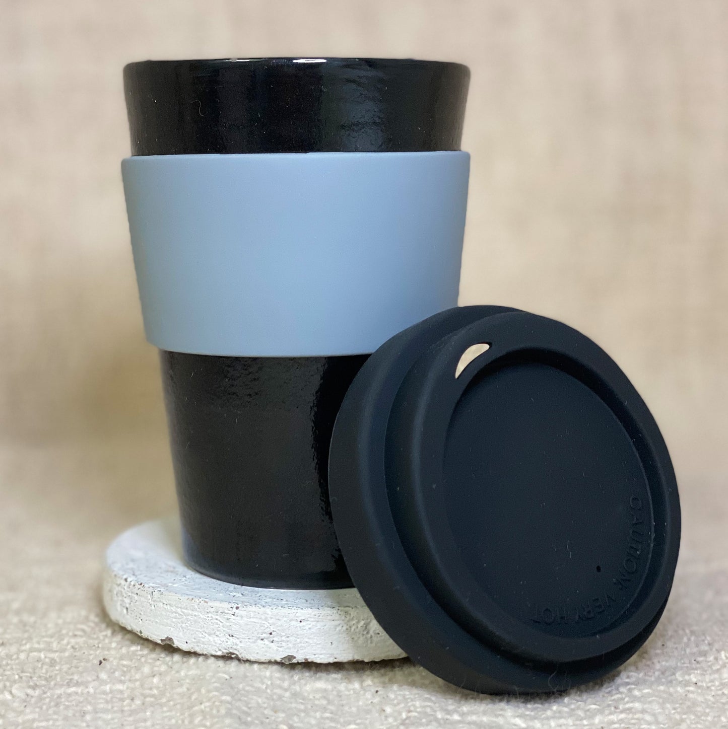 Handmade in Noosa black ceramic mug with customised cuff
