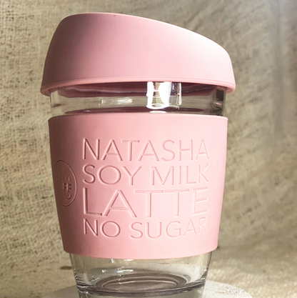 natasha soy milk latte no sugar engraved on keep cup in glass