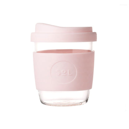 Pink reusable coffee cup in glass with personalised cuff