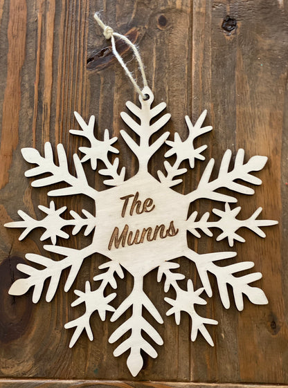 Handmade personalised wooden snowflake with family name christmas decoration